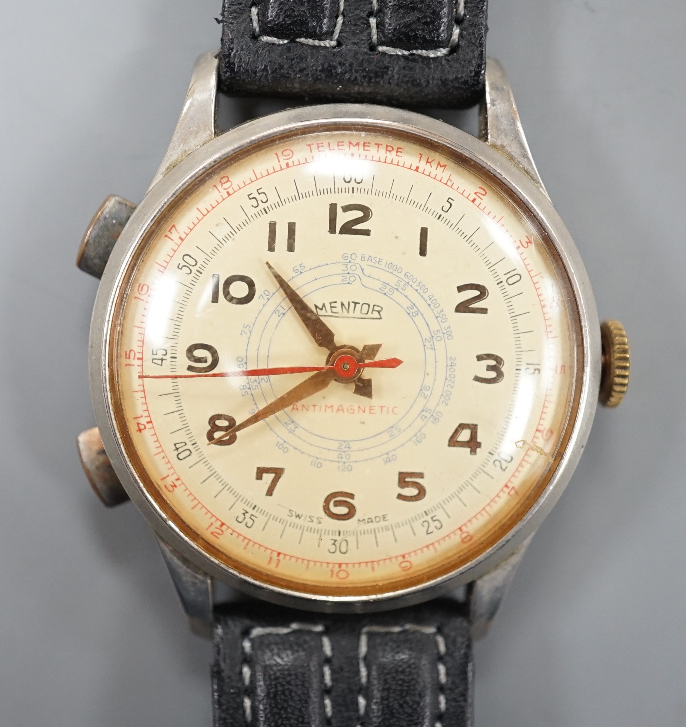 A gentleman's mid 20th century stainless steel Mentor chronograph wrist watch, on associated leather strap.